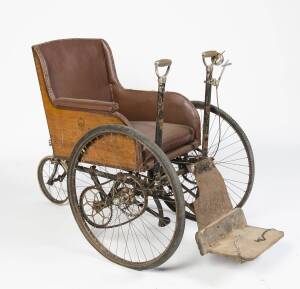A WW1 period mechanical wheelchair manufactured by Lewis of Adelaide.