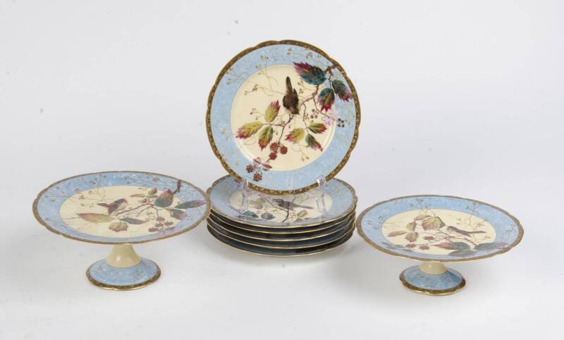 A French hand painted porcelain part dessert suite comprising 2 comports & 6 plates, late 19th Century.