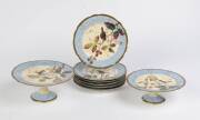 A French hand painted porcelain part dessert suite comprising 2 comports & 6 plates, late 19th Century.