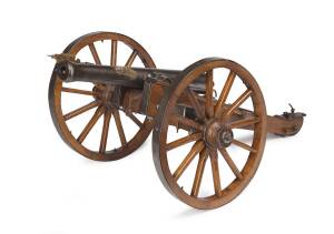 A Spanish cast iron cannon & oak carriage. The cannon: 38cm. 