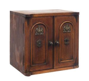 An antique walnut compendium stationary box, two doors emblazoned with English coats of arms & fitted interior. 24cm high, 25cm wide, 28cm deep.