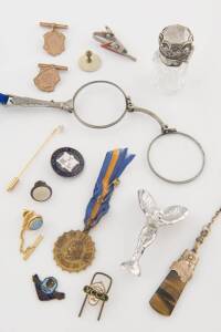 A collection of jewellery including antique stickpins, hat pin, badges, sterling silver topped perfume bottle, lorgnettes, cufflinks etc. 19th & 20th Century.