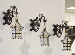 A set of Art Nouveau glass & wrought metal wall sconces, late 19th/early 20th Century.