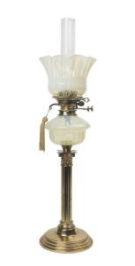 A kerosene banquet lamp with yellow vaseline shade and font, double black button burner with bayonet mount & brass Corinthian column base. 79cm. 