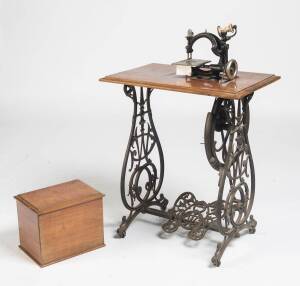 A chromed cast iron Willcox & Gibbs sewing machine on the original cast iron foot pedal base, Circa 1890