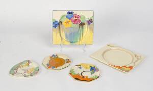 A collection of Clarice Cliff plates, comprising a "Woodland" and a "Crocus" hexagonal saucer, a "Taormina" and a "Pansies" rectangular plate and a triangular Aurea coloured Rhodanthe saucer