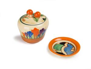 A Clarice Cliff "Crocus" patterned jam pot (8cm), & a "Blue Gardenia" patterned pin dish (7cm diameter)