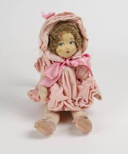 Shirley Temple doll in pink costume, circa 1930s. 39cm