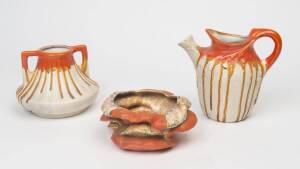 Three pieces of orange glazed European Art Deco pottery. including 2 vases & a jug, The tallest 21cm. 