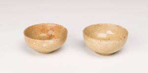 A pair of Chinese stoneware bowls, Sui dynasty (581-618), 8.5cm diameter.