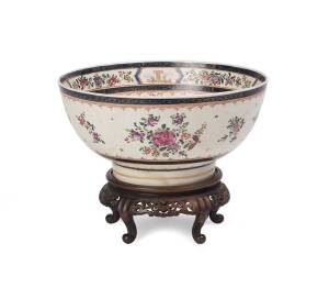 A Chinese famille rose pattern bowl on carved timber stand. 14cm high, 30.5cm diameter