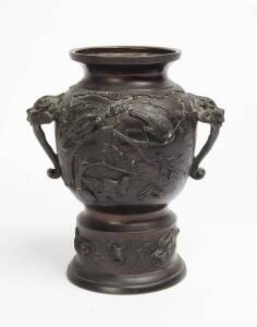 A Japanese bronze Hu shaped vase, Meiji period, 20th Century, maker's mark to the base. 32cm high