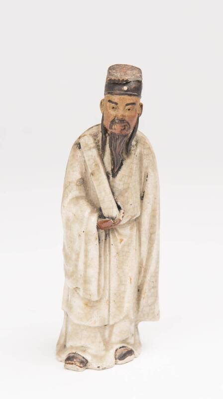 A Chinese "Shiwan" stoneware figure of Taoist deity, 20th Century. 13.5cm high.