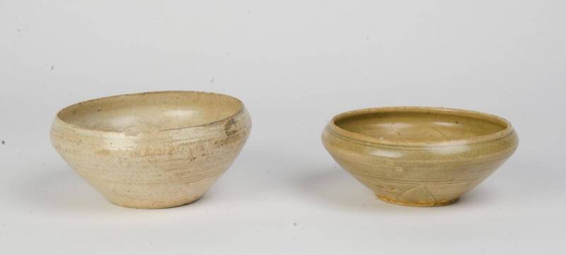 Two celadon bowls with inverted rims and incised decoration, circa 14th Century. 18cm diameter