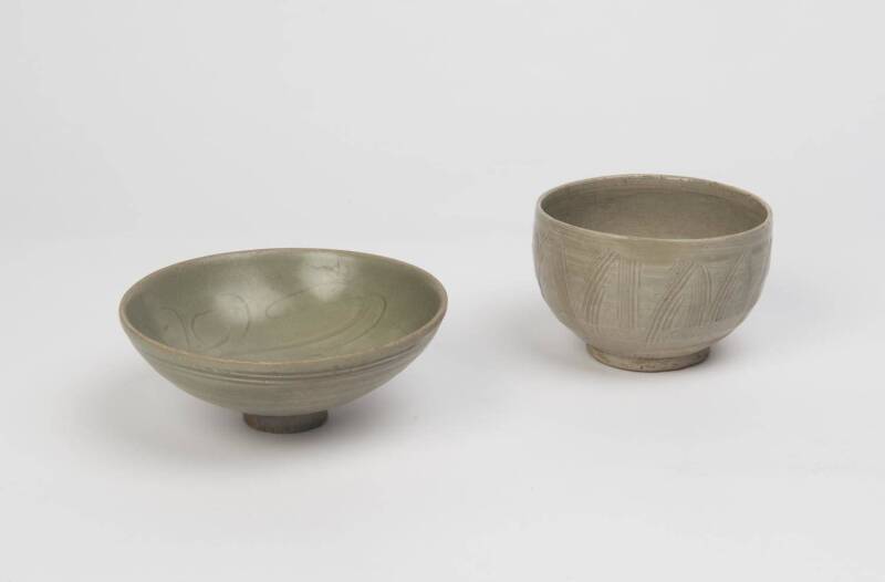 Two Chinese incised celadon bowls, Song-Yuan dynasties, 10th-13th Century. 12.5cm and 16.5cm diameter