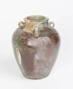 A Vietnamese ovoid stoneware jar with four lug handles and copper oxidized glaze, circa 17th Century. 23cm high