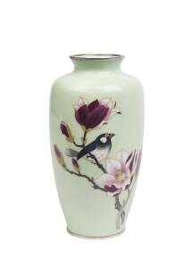 A Japanese pale green ground cloisonné vase decorated with a bird, signed Sato 25cm high