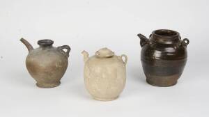 A group of three Vietnamese stoneware ewers, 15-17th Century. 18-20cm high.