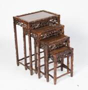 A nest of four Chinese carved rosewood side tables, 20th Century. The largest 72cm high, 51cm wide, 36cm deep