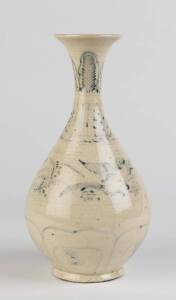 A Vietnamese blue and white pear shaped vase, painted with a pair of birds and stylized bands, circa 16th Century. 31cm high