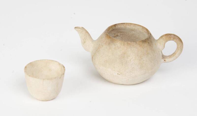 A rare stone tea pot and small cup, 17th-18th Century. 9cm and 4cm high