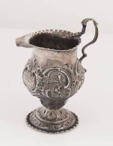 A George III sterling silver floral cream jug by Nathaniel Appleton & Ann Smith, London 1779 10cm high, 75grams