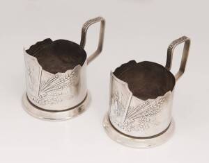 A pair of Russian silver tea glass holders, 20th Century. 9cm high, 200 grams total weight