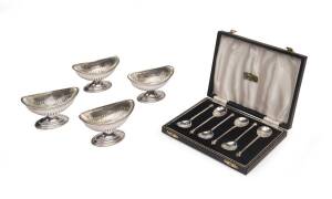 A set of four English sterling silver salt cellars with glass liners, London 1882, together with box set of sterling silver spoons.