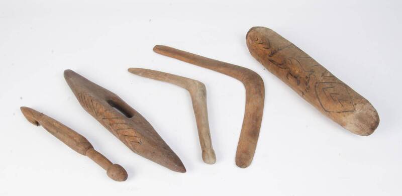 A group of Aboriginal childrens artifacts including 2 shields, Woomera, Leangle & boomerang. Largest 46cm. (5 items)