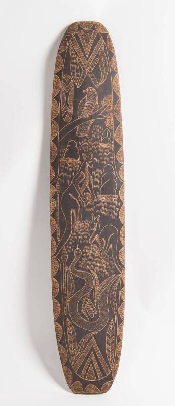 A Kimberly shield, carved with animal motifs, mid 20th Century. 96cm