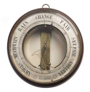 A ships metallic barometer stamped "E. Bourdon and Richards, Patent, Paris. Universal Exhibition, London, 1849". 23cm diameter.