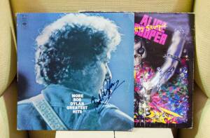 AUTOGRAPHS, noted LP records signed by Bob Dylan & Alice Cooper; autograph book signed by The Rondells; V8 Supercar drivers (16).