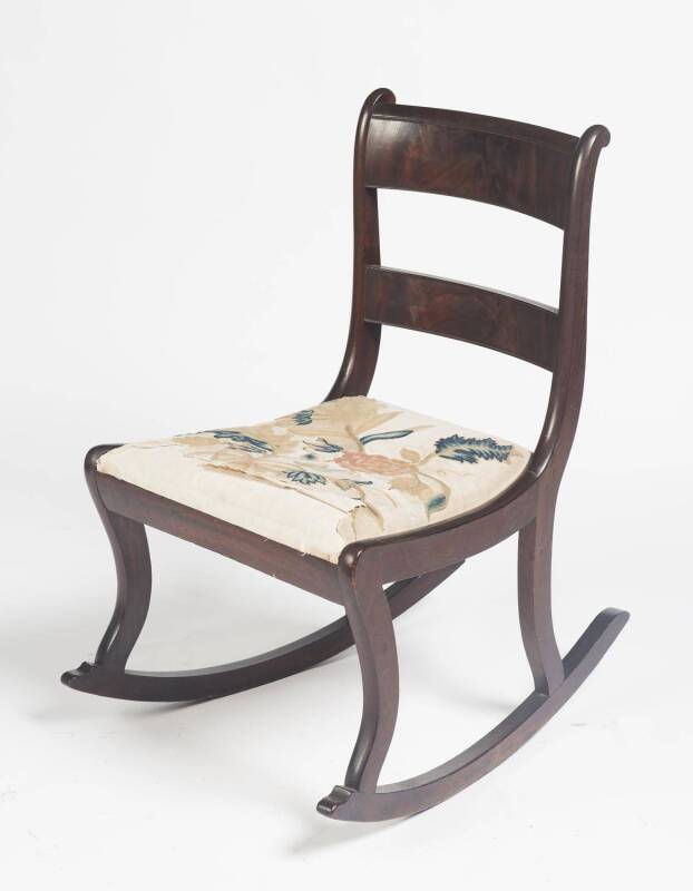 A William IV mahogany rocking chair. 