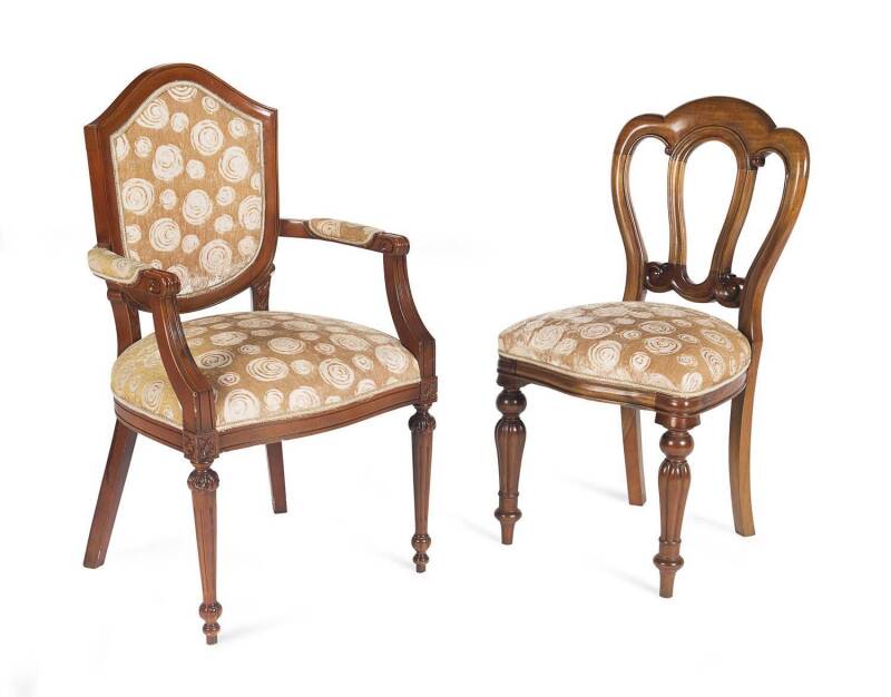 A set of six Victorian style mahogany dining chairs with a pair of associated carvers, 20th Century. 