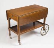 A mahogany drinks trolley, 20th Century. 77cm high, 92cm wide, 92cm deep.