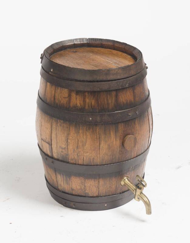 A French oak metal bound spirit keg with brass tap. 21cm high, 46cm deep.