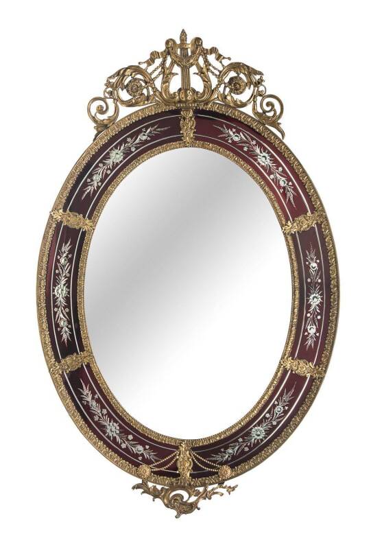 A Louis XV style brass mounted and ruby etched oval salon mirror. 120 x 79cm. 