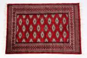 Three hand woven Pakistani red pattern rugs. Approximately 130 x 155cm each.  - 3