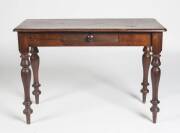 An Australian cedar single drawer side table, 19th Century. 72cm high, 107cm wide, 50cm deep