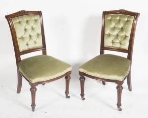 A set of 8 Victorian walnut button back dining chairs.