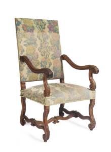 A Louis XIV style carved walnut armchair. 