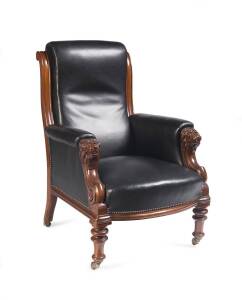 An antique gentleman's chair, carved walnut and leather, Circa 1870's.