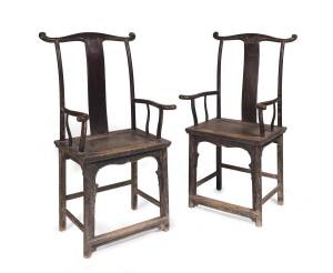 A pair of Chinese elm yoke back scholars chairs.