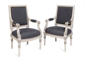 A pair of Louis XVI style white & grey painted armchairs