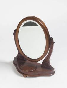 A Victorian mahogany toilet mirror with stud compartment. 60cm high, 50cm wide, 23cm deep.