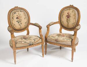 A Pair of Louis XVI carved beechwood and tapestry fauteuil.