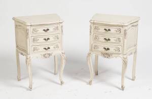 A pair of French provincial style white painted bedside tables. 