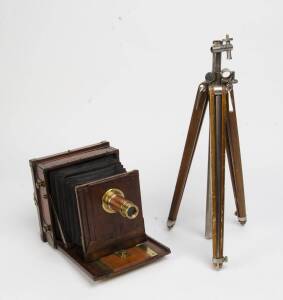 An early 20th century half-plate tailboard timber camera with brass lens. The camera appears incomplete, with non-original timber insert and requires restoration.