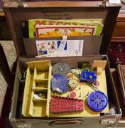 Meccano set in small suitcase with various instruction booklets. Inspection will reward.