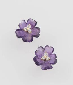 A pair of amethyst and diamond earrings, the amethyst flower with detachable diamond centre. 14ct yellow gold. Width 17mm. Stud fittings. 